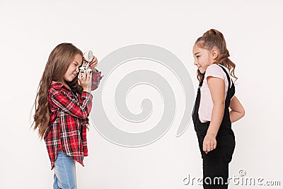 Two little girls taking a picture of each other Stock Photo