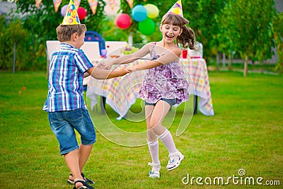 Two little kids dancing roundelay Stock Photo