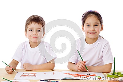 Two little kids draw with watercolor Stock Photo