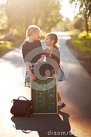 Two little sisters school kids happy back to school Stock Photo