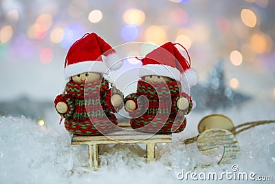 Two little snow girl wish merry xmas, bokeh Stock Photo