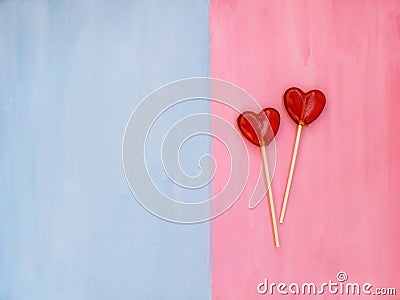 Two lollipops on pink and blue background. Love concept. Valentines day Stock Photo