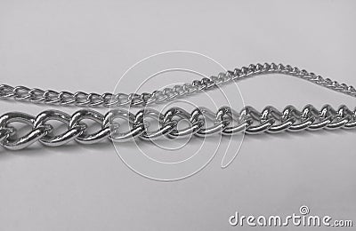 Two long silver chains with a white background Stock Photo