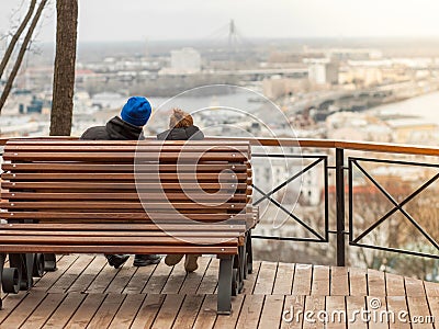 Two lovers, in a romantic setting, admire the view of the city landscape Editorial Stock Photo