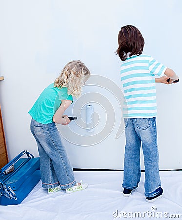 Two loving siblings decorating their house Stock Photo