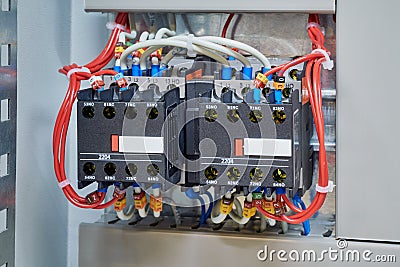 Two magnetic contactor connected in reverse starting Assembly Stock Photo