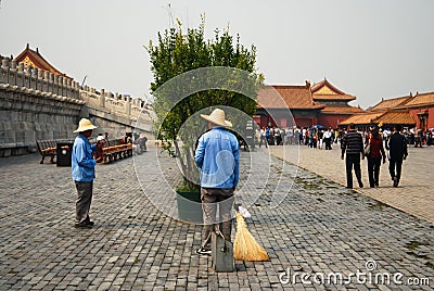 Two maintenance workers having a conversation in the Forbidden City area Editorial Stock Photo