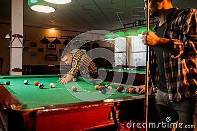 Two male billiard players with cues poses Stock Photo