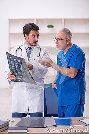 Two male doctors radiologists working in the clinic Stock Photo