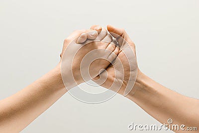 Two male hands competion in arm wrestling isolated on grey studio background Stock Photo