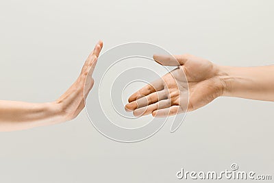 Two male hands isolated on grey studio background Stock Photo