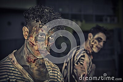 Two male zombies standing outdoor at night for Halloween Stock Photo