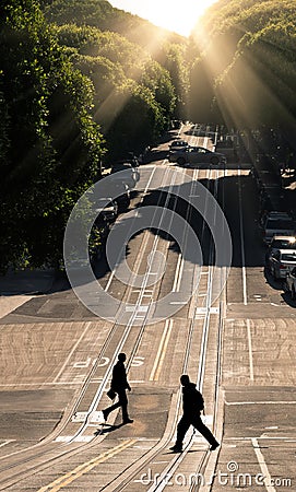 Two man crossing the road - San Francisco, Hyde Street Stock Photo