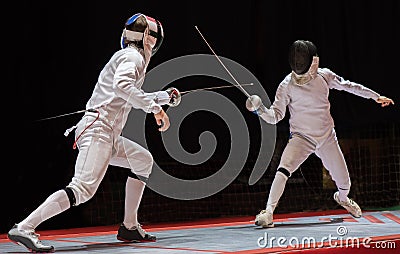 Two man fencing athletes fight Stock Photo