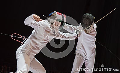 Two man fencing athletes fight Stock Photo