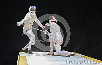 Two man fencing athletes fight Editorial Stock Photo