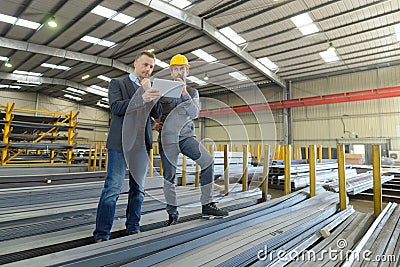 Two managers workers in warehouse with tablet computer Stock Photo