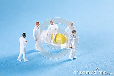 Two medics transporting a pill on a stretcher while a doctor is sitting on top Stock Photo