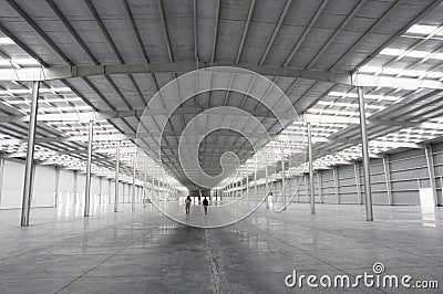 Large warehouse for industrial purposes illuminated by solar light Stock Photo