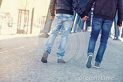 Two men holding hands Stock Photo