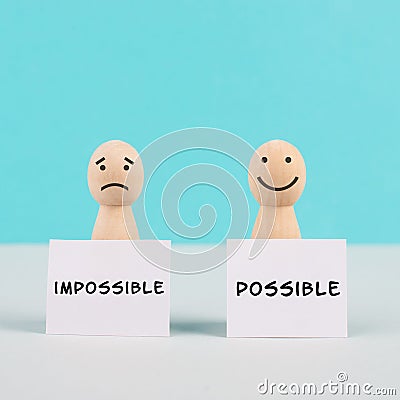 Two men holding signs, possible and impossible concept, mindset of an optimist and a pessimist, change the attitude for progress Stock Photo