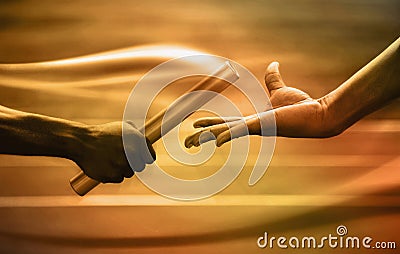 Two men passing golden baton in stadium. Conceptual image shot Stock Photo