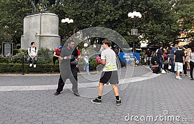 Two men practice boxing in Union Square Park New York City. Editorial Stock Photo
