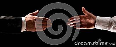 Two men reaching out to shake hands Stock Photo