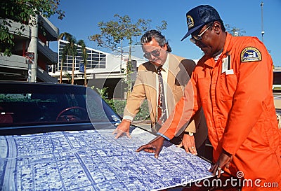 Two men reviewing blueprints Editorial Stock Photo