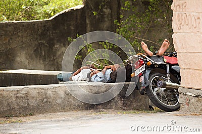 Two men sleeping under shade Editorial Stock Photo