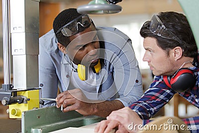 two men in workshop Stock Photo