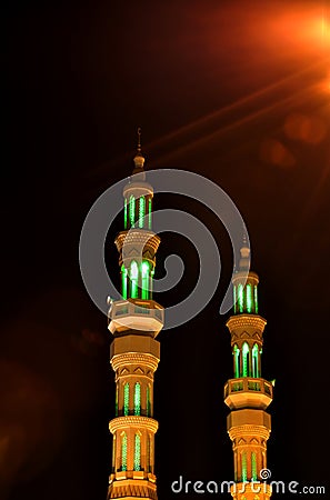 Two minarets in the night in United Arab Emirates Stock Photo