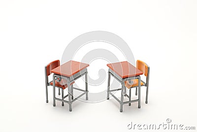Two miniature school desks on white background. Stock Photo