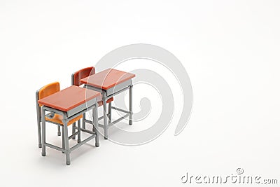 Two miniature school desks on white background. Stock Photo