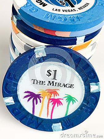 Two Mirage $1 Poker Chips on a Black Backdrop Editorial Stock Photo