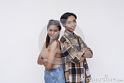 Two modern freshman university students. One Filipina lady and one chinese guy. Isolated on a white background Stock Photo