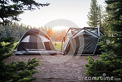 Two modern tents on campsite in Yellowstone National park at sunset time Stock Photo
