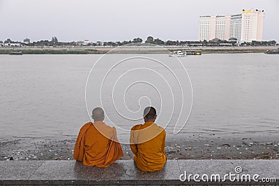 Two monks in Phnom Penh in late afternoon Editorial Stock Photo