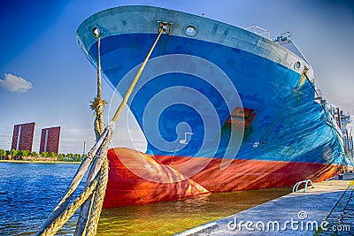 Two Mooring Ropes From Foredeck of Sea Tanker Moored at Pier Stock Photo