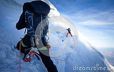 Two mountaineers climb steep glacier ice crevasse extreme sports, Mont Blanc du Tacul mountain, Chamonix France travel, Europe Stock Photo