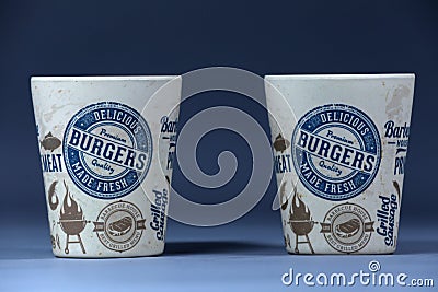 Two mugs with Grilled Burger print, copy space Editorial Stock Photo