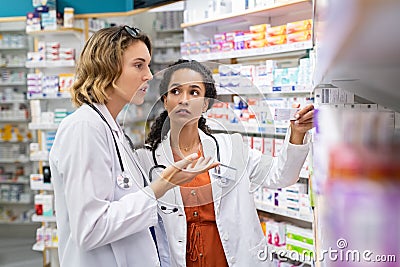 Doctor and pharmacist working at pharmacy Stock Photo