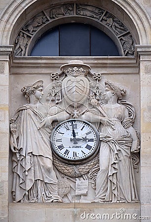 Two muses support the clock, topped by the coat of arms of Cardinal Richelieu, Saint Ursule chapel of the Sorbonne in Paris Editorial Stock Photo