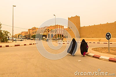 Two Muslim Women Seek Comfort in a Medieval Walled City Editorial Stock Photo