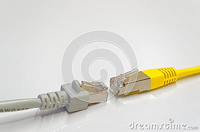 Two network connection plugs in opposite of each other Stock Photo