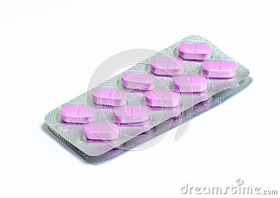 Two new packs of 10 pink oblong pills isolated on a white background Stock Photo