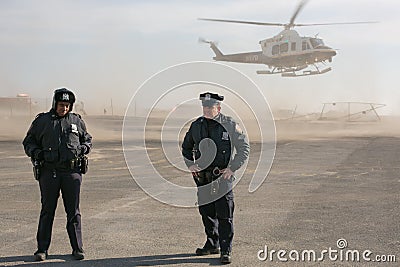 Two NYPD police officers at helicopter landing Editorial Stock Photo