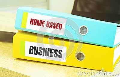 Two office folders with text home based business Stock Photo