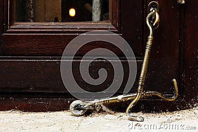 Old brass hook for windows Stock Photo