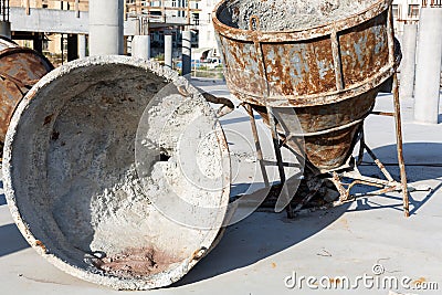 Two old huge rusty concrete mixers Stock Photo